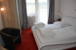 Postel nebo postele na pokoji v ubytování Hotel Böhmerwaldhof