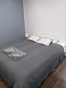 Postel nebo postele na pokoji v ubytování Studio Fibra Doppio