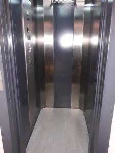 an elevator in a building with its door open at Sweet Home Arco in Arco