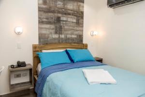 Postel nebo postele na pokoji v ubytování Hotel Ciudad Latin Palace