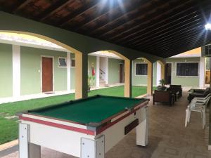 a pool table in the middle of a patio at Hotel Colonial in Pôrto Real