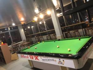 a pool table with balls on it in a room at Peaceful House Hostel in Dong Hoi