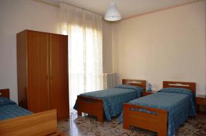 A bed or beds in a room at Hotel A-14