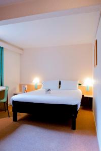 Кровать или кровати в номере ibis Grenoble Centre Bastille