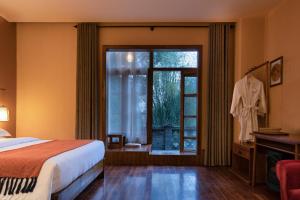 Postel nebo postele na pokoji v ubytování Moondance Boutique Resort