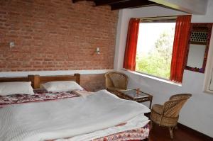 Ліжко або ліжка в номері Hotel At The End Of The Universe