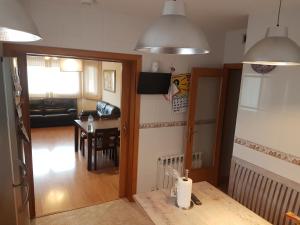a living room and dining room with a table at VILLA FLOR in Cambrils