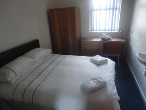 a bedroom with a bed and a desk at Royal Chambers Liverpool in Liverpool