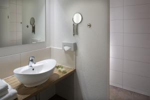 Koupelna v ubytování Hotel Nesselwanger Hof