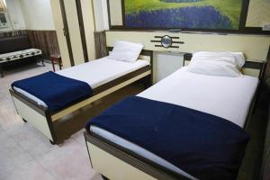 Postel nebo postele na pokoji v ubytování Hotel Happy Home