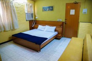 Postel nebo postele na pokoji v ubytování Hotel Happy Home