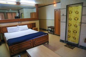 Postel nebo postele na pokoji v ubytování Hotel Happy Home