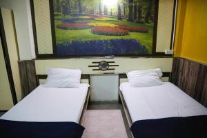 Postel nebo postele na pokoji v ubytování Hotel Happy Home