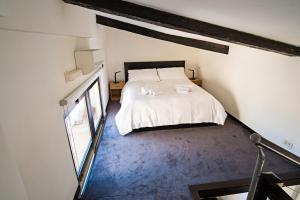 Säng eller sängar i ett rum på Erida Apartment - Piazza di Spagna