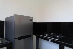 Kuchyň nebo kuchyňský kout v ubytování Gangga Guest House