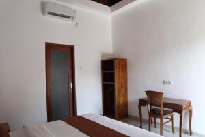 Postel nebo postele na pokoji v ubytování Gangga Guest House