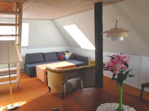 a living room with a couch and a table at Struckshus in Tønder