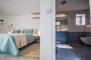 Posteľ alebo postele v izbe v ubytovaní Villa Mamma Mia Oprtalj