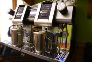 a coffee maker is sitting on a shelf at Casa Rural Priena in Covadonga