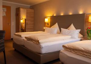 Postel nebo postele na pokoji v ubytování Hotel Morjan