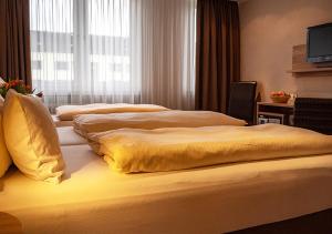 Postel nebo postele na pokoji v ubytování Hotel Morjan