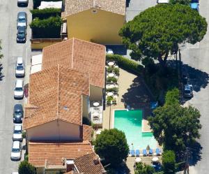 an overhead view of a house with a swimming pool at Hôtel Lou Paouvadou in Sainte-Maxime