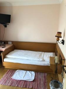 Postel nebo postele na pokoji v ubytování Hotel Pflieger