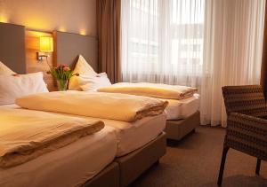 Postel nebo postele na pokoji v ubytování Hotel Morjan