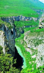 an aerial view of a river in a canyon at Hôtel Lou Paouvadou in Sainte-Maxime