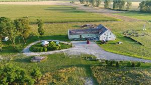 an aerial view of a barn in a field at Turistika ubytovňa sivá brada in Spišské Podhradie