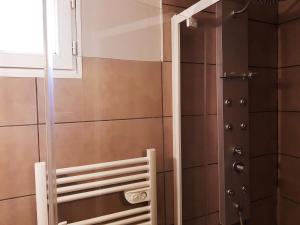 a bathroom with a shower and a mirror at Le Domaine d'Alèzen in Grans +62 photos