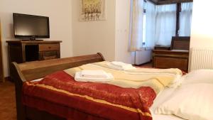 Ein Bett oder Betten in einem Zimmer der Unterkunft Hotel 3 Gemsen
