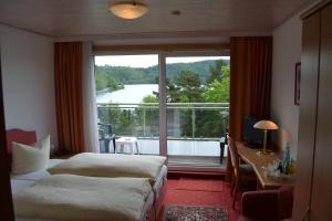 Postel nebo postele na pokoji v ubytování Seehotel Andree & Gästehaus Seehof