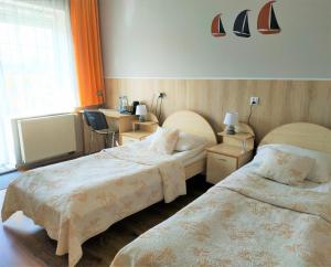 Posteľ alebo postele v izbe v ubytovaní Hotel Helena