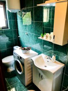 a bathroom with a washing machine and a sink at "NM" Luxury apartments in Split