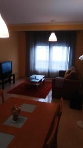 a living room with a couch and a coffee table at Apartamento Sobradelo in Vilagarcia de Arousa