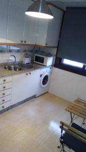 A cozinha ou cozinha compacta de Apartamento Sobradelo