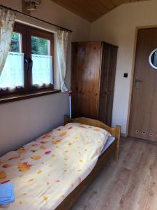 Postel nebo postele na pokoji v ubytování Ośrodek Wypoczynkowy Hacjenda