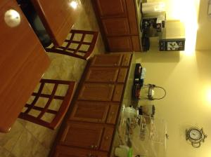 a kitchen with wooden cabinets and a stairway with at Hometown Inn-Soddy Daisy in Soddy-Daisy