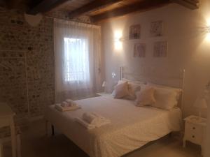 Postel nebo postele na pokoji v ubytování La Corte di Rosa