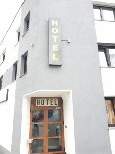 a hotel sign on the side of a building at Kirchberg Hotel garni in Saarbrücken