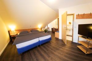 Postel nebo postele na pokoji v ubytování Hotel Restaurant Waldlust
