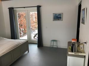 Postel nebo postele na pokoji v ubytování B&B Boerderij De Vaete - Duurzaam genieten in de zak van Zuid-Beveland