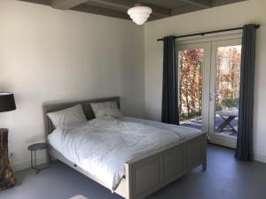 Postel nebo postele na pokoji v ubytování B&B Boerderij De Vaete - Duurzaam genieten in de zak van Zuid-Beveland