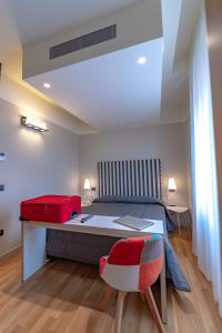 Postel nebo postele na pokoji v ubytování Hotel Moderno