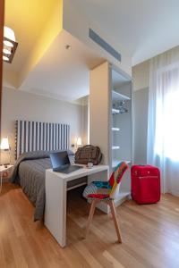 Postel nebo postele na pokoji v ubytování Hotel Moderno