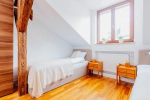 Posteľ alebo postele v izbe v ubytovaní Atticus Apartments