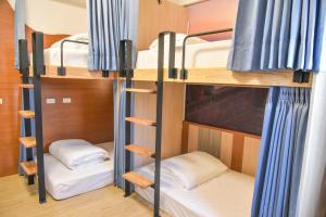 Postel nebo postele na pokoji v ubytování D.C. Inn