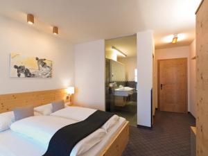 Ліжко або ліжка в номері Hotel Garni Frommes
