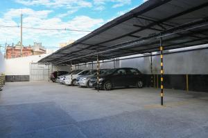 a parking lot with cars parked in a garage at Hotel Express Rodoviária in Porto Alegre